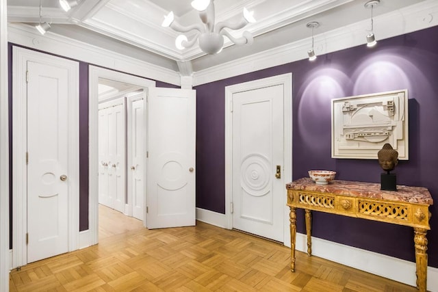 entryway with an inviting chandelier, crown molding, and light parquet floors