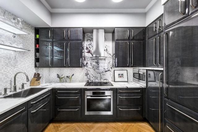 kitchen featuring backsplash, wall chimney exhaust hood, sink, and stainless steel appliances