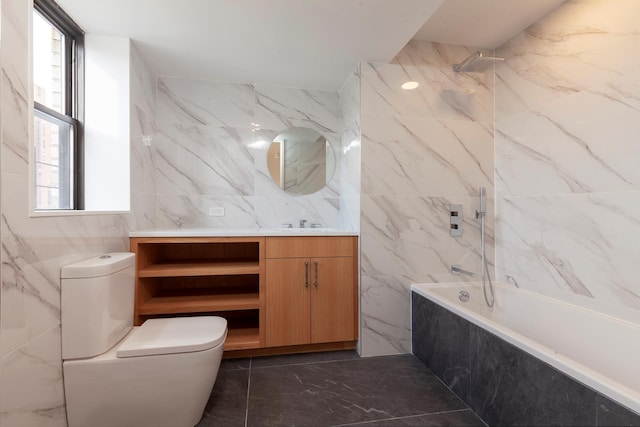 120 E 90th St Unit 15Ade, New York City, NY 10128 - bathroom with tile walls, toilet, vanity, marble finish floors, and a combined bath / shower with marble appearance