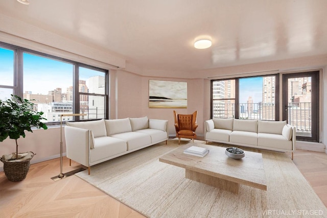 living room with light parquet floors and a wealth of natural light