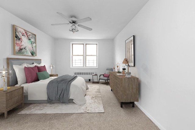 carpeted bedroom featuring radiator and ceiling fan