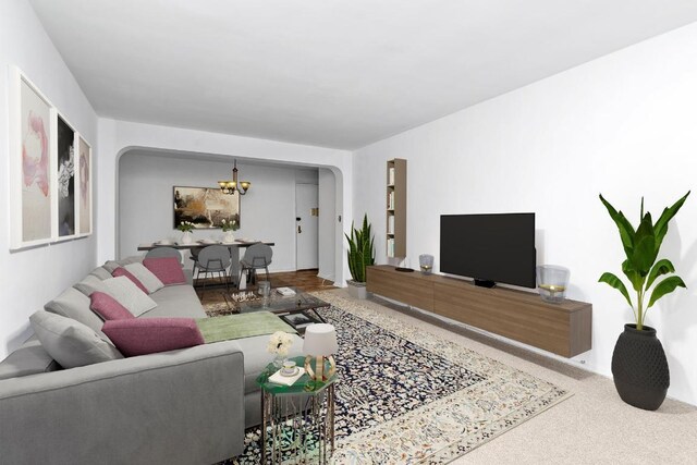 living room with carpet and an inviting chandelier