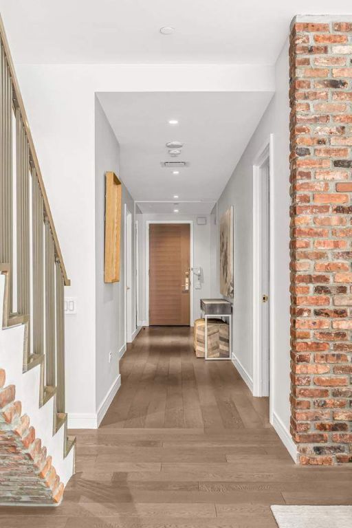 hallway featuring wood-type flooring