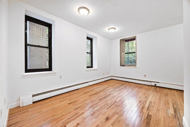 2090 Madison Ave Unit 1D, New York City, NY 10037 - empty room featuring wood finished floors and a baseboard radiator