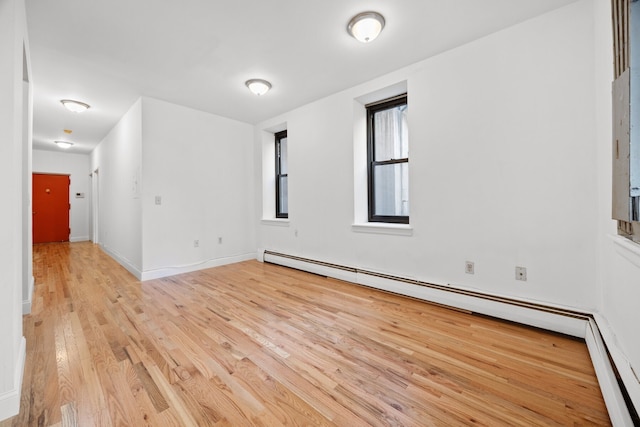 2090 Madison Ave Unit 1D, New York City, NY 10037 - unfurnished room featuring light wood-type flooring, a baseboard heating unit, and baseboards