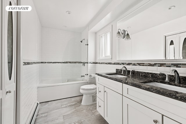 full bathroom featuring toilet, tiled shower / bath, tile walls, vanity, and a baseboard heating unit