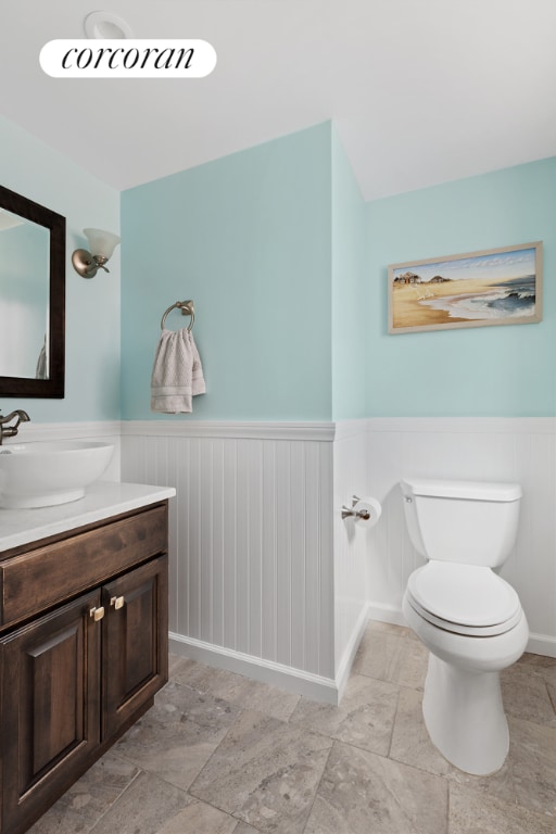 bathroom featuring vanity and toilet