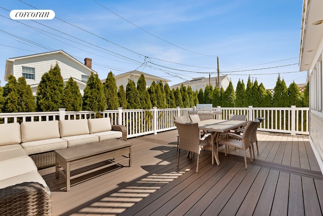 wooden deck featuring an outdoor living space