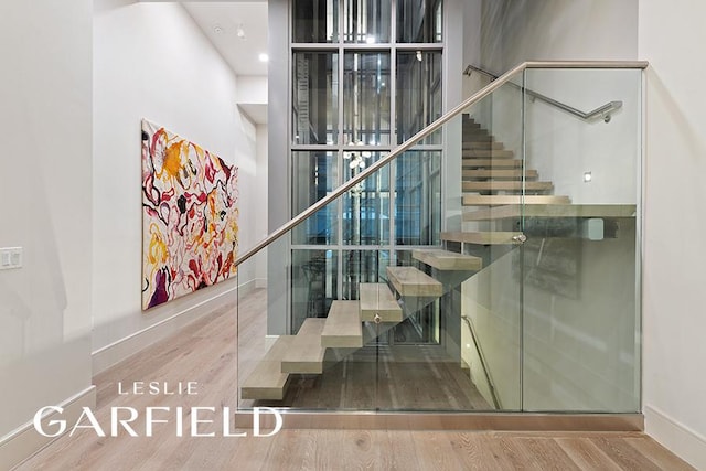 staircase featuring hardwood / wood-style floors