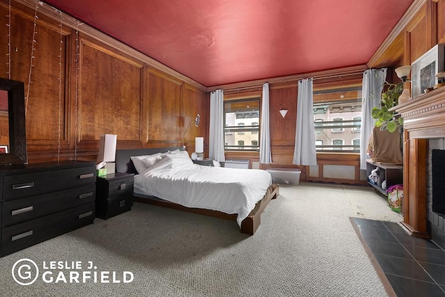 carpeted bedroom with ornamental molding