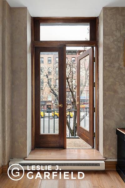 entryway with hardwood / wood-style flooring