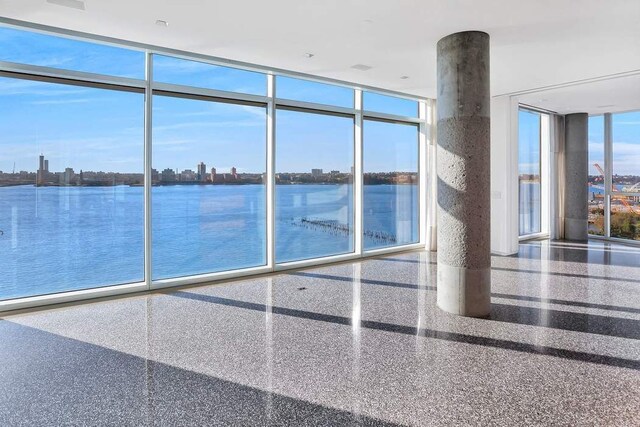 view of swimming pool featuring a water view and a view of city