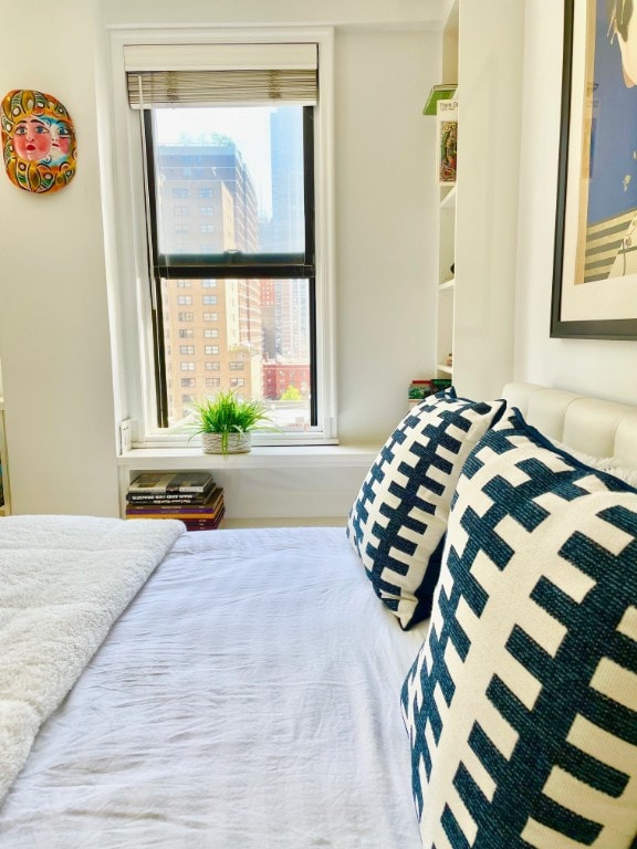 bedroom with multiple windows