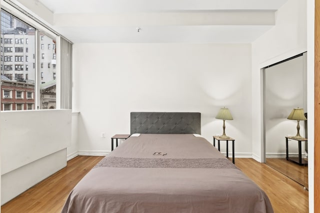 bedroom with hardwood / wood-style floors