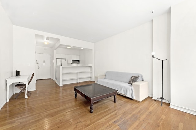 living room with light hardwood / wood-style floors