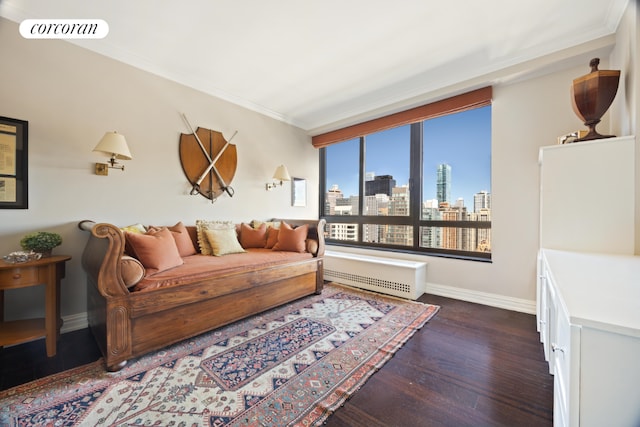 living room featuring crown molding and dark hardwood / wood-style floors