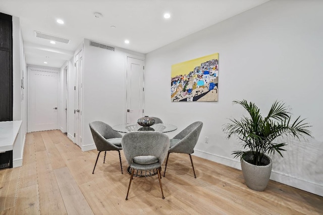 dining area with light hardwood / wood-style floors