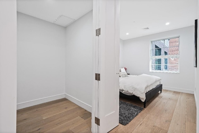 bedroom with light hardwood / wood-style flooring