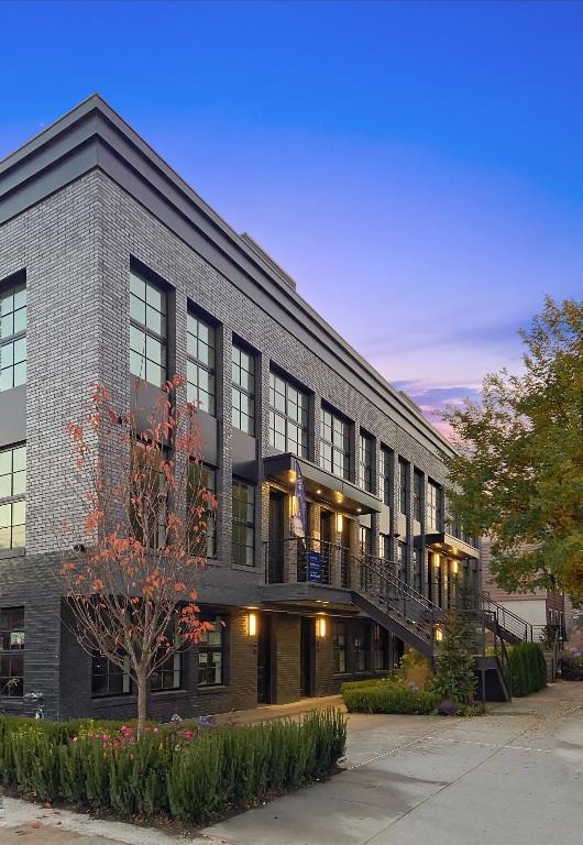 view of outdoor building at dusk