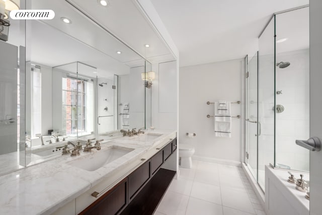 bathroom with tile patterned floors, toilet, an enclosed shower, and vanity