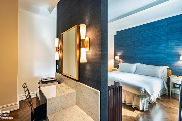 bedroom featuring ornamental molding and parquet floors