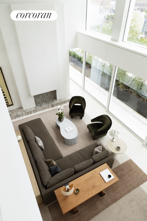 living room featuring a towering ceiling