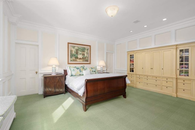 carpeted bedroom featuring ornamental molding