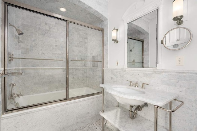 435 E 52nd St Unit 14G, New York City, NY 10022 - bathroom with tiled shower / bath combo and tile walls