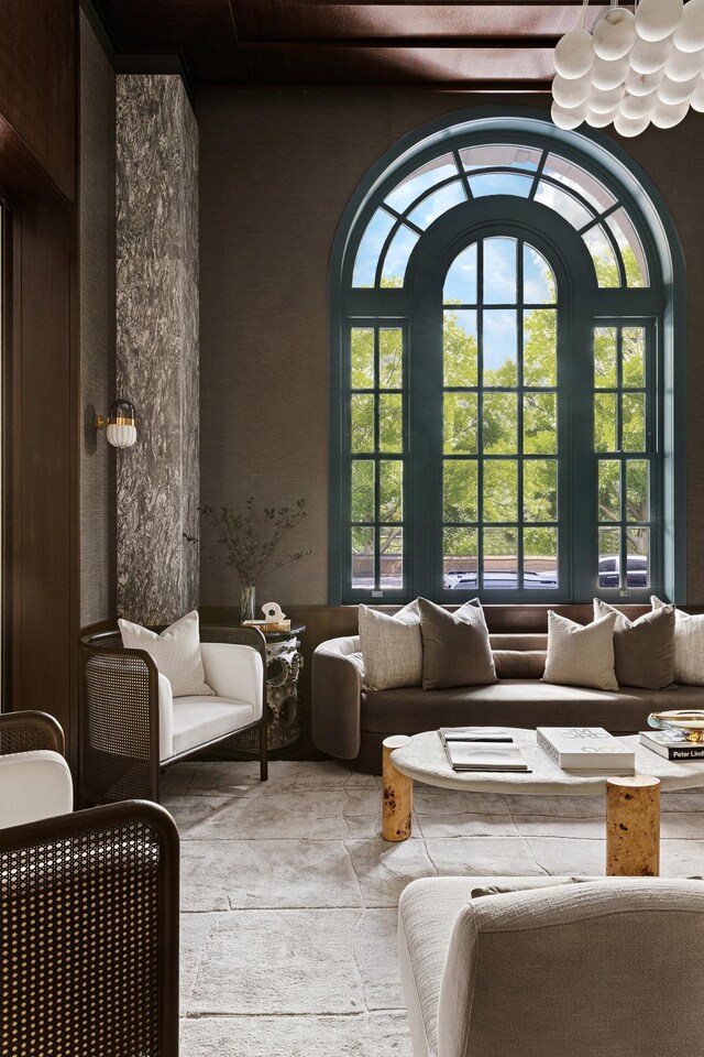 interior space with wood ceiling, a fireplace, built in features, and wood walls