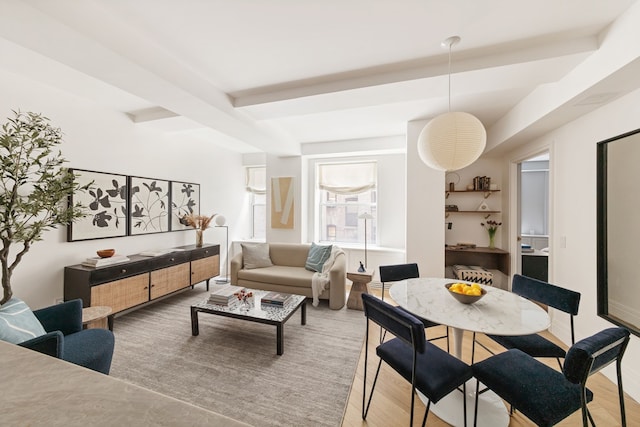 living room with wood-type flooring and beam ceiling