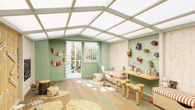 sunroom / solarium featuring lofted ceiling