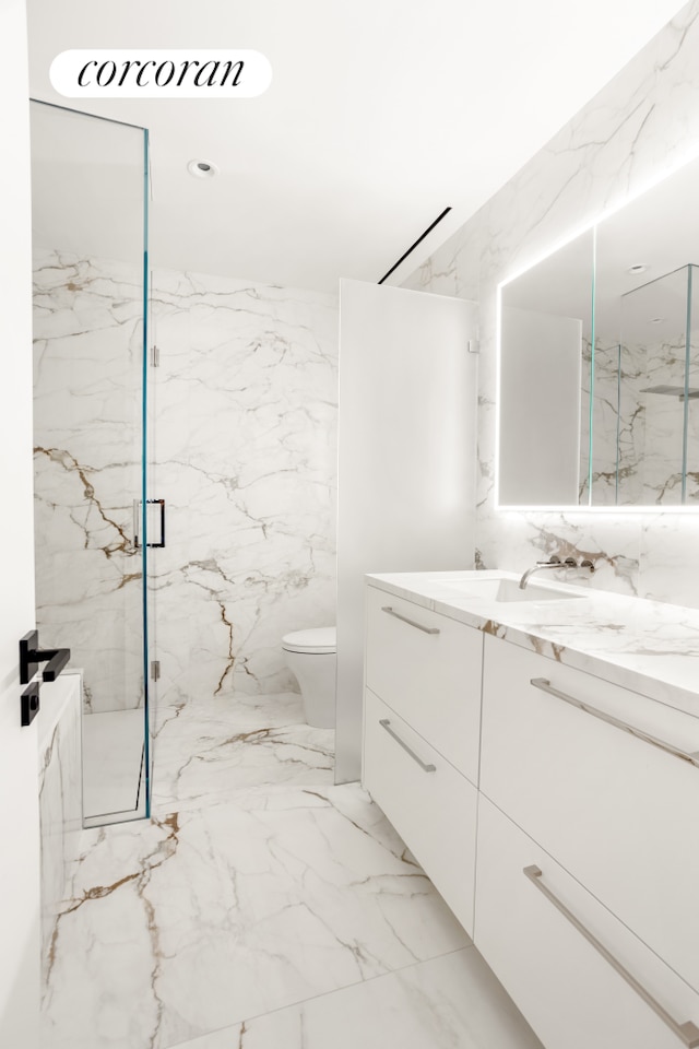 248 W 71st St, New York City, NY 10023 - full bathroom featuring vanity, marble finish flooring, toilet, and a marble finish shower