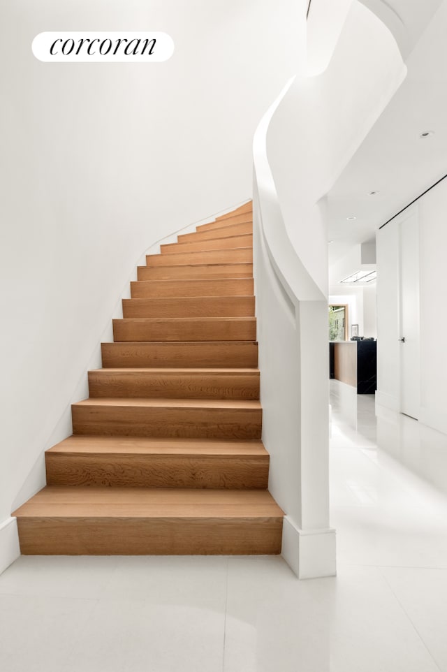248 W 71st St, New York City, NY 10023 - stairs featuring tile patterned floors