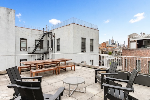 view of patio featuring a view of city and outdoor dining area