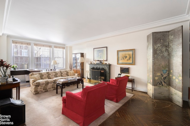 living room featuring parquet floors, crown molding, and a fireplace