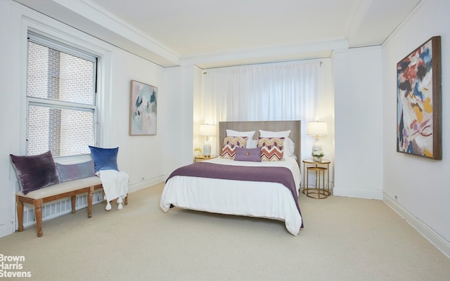 carpeted bedroom featuring ornamental molding