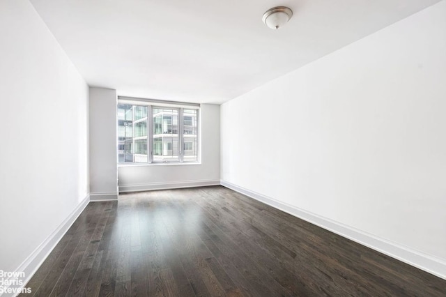 empty room featuring dark hardwood / wood-style floors