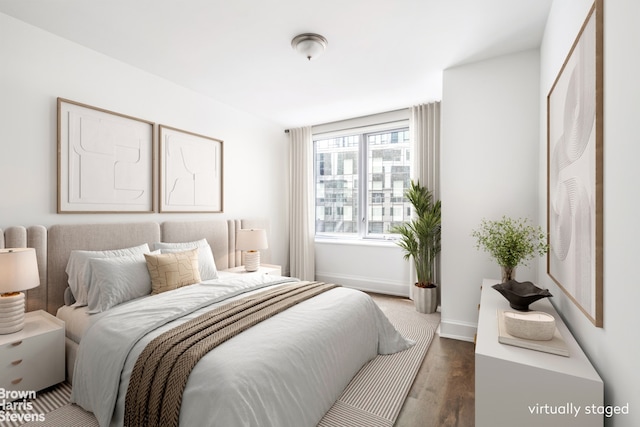 bedroom with wood-type flooring