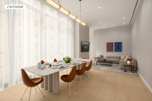 dining area featuring recessed lighting, light wood-style flooring, and baseboards