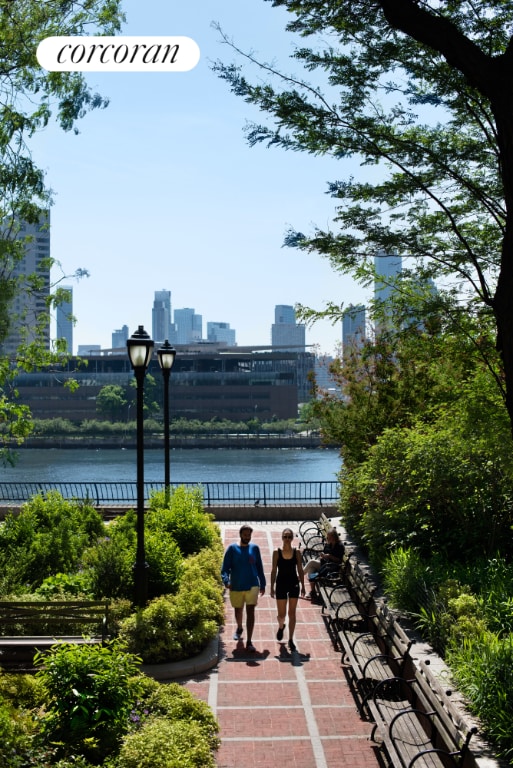 surrounding community featuring a water view and a city view