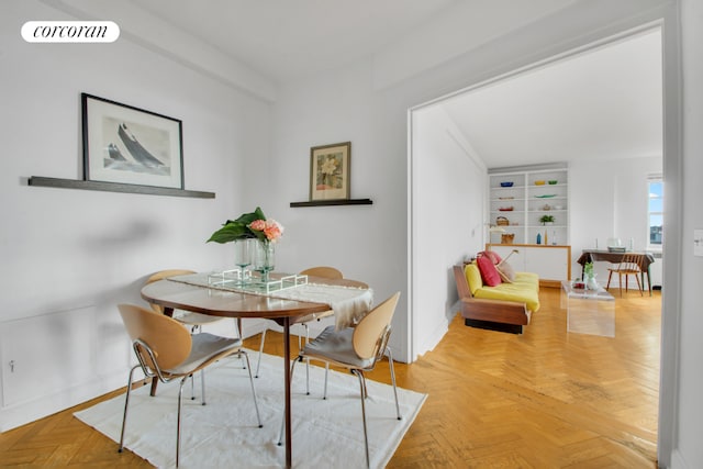 dining space with parquet floors