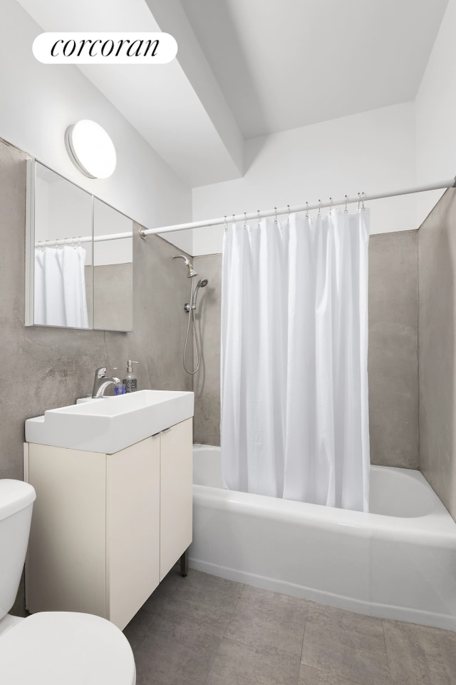 bathroom featuring vanity, tile patterned floors, toilet, and shower / tub combo with curtain