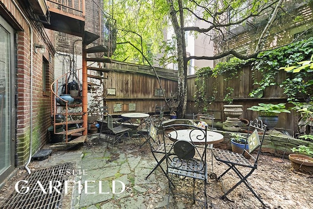 321 E 6th St, New York City, NY 10003 - fenced backyard featuring a patio