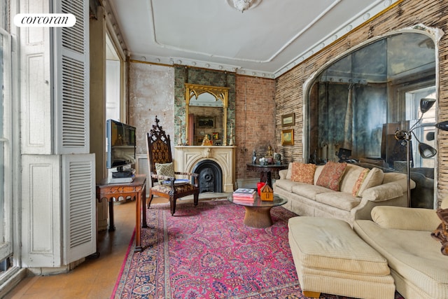 living room featuring brick wall