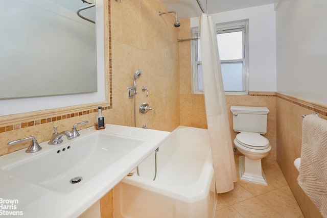 full bathroom with shower / bathtub combination with curtain, tile patterned flooring, sink, tile walls, and toilet