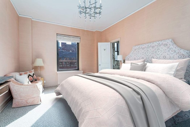 carpeted bedroom featuring ornamental molding and a chandelier