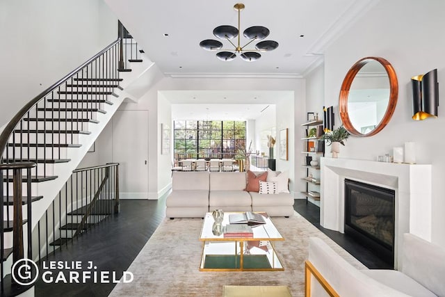 unfurnished living room with dark hardwood / wood-style floors, an inviting chandelier, and ornamental molding