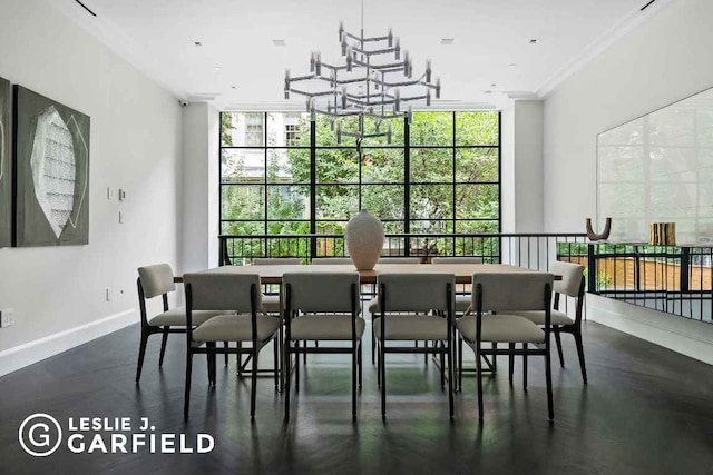 dining space featuring plenty of natural light, expansive windows, and crown molding