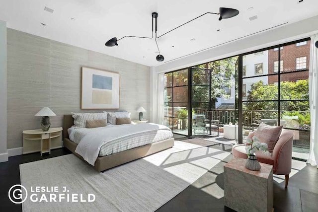 bedroom featuring access to exterior and multiple windows