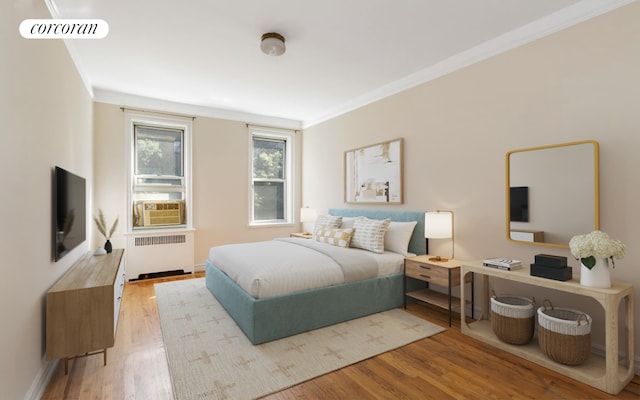 bedroom featuring radiator, visible vents, ornamental molding, wood finished floors, and cooling unit